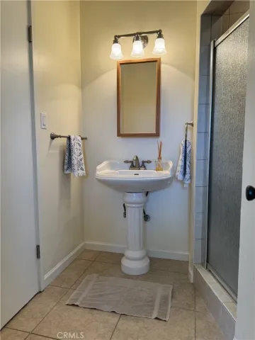 a bathroom with a sink and mirror