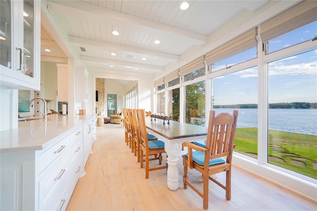 582 Windy Point Mount Vernon, TX 75457 - Photo 16 of 38 Sunroom with healthy amount of natural light, beamed ceiling, and a water view