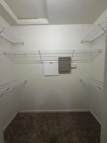 an empty room with a cabinet