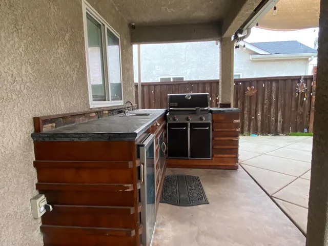 a kitchen with a stove a sink and a microwave