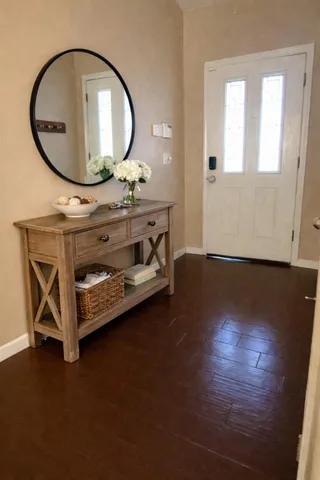 a view of a livingroom with furniture and wooden floor