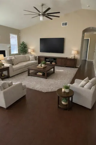 a living room with furniture and a flat screen tv