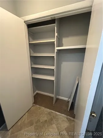a bathroom with a granite countertop sink toilet a mirror and bathtub
