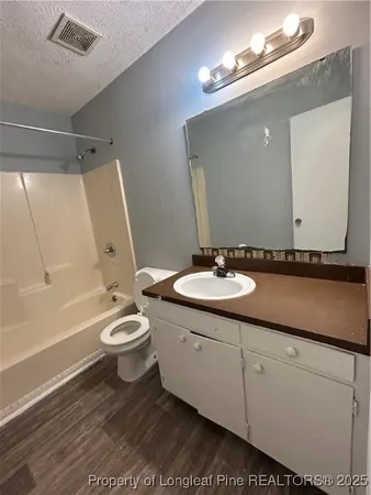 a white toilet sitting next to a toilet