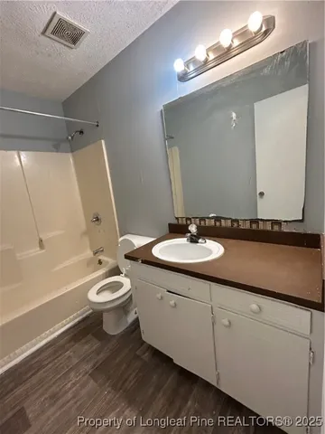 a white toilet sitting next to a toilet