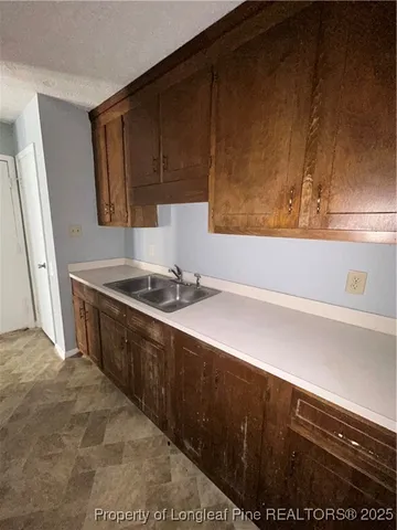 a white stove top oven sitting inside of a kitchen