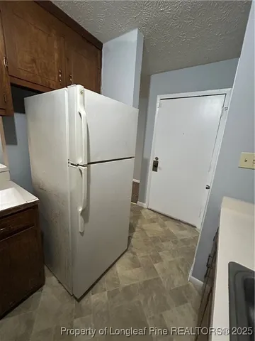 a view of an empty room and fire place