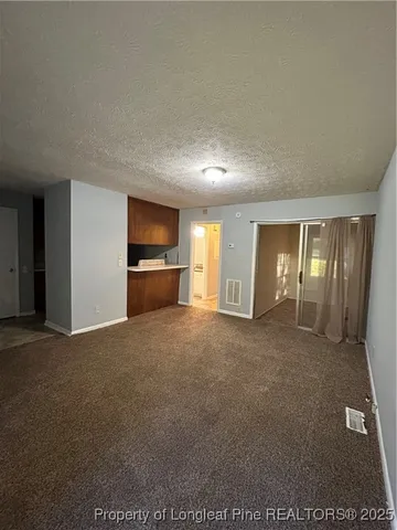 a view of an empty room with window