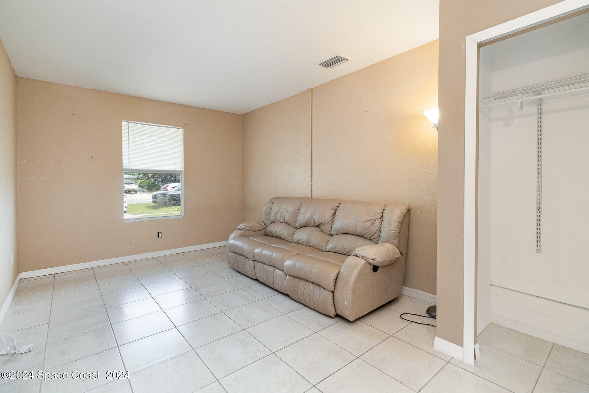 2357 Sarno Road Melbourne, FL 32935 - Photo 13 of 19 a living room with furniture and a window