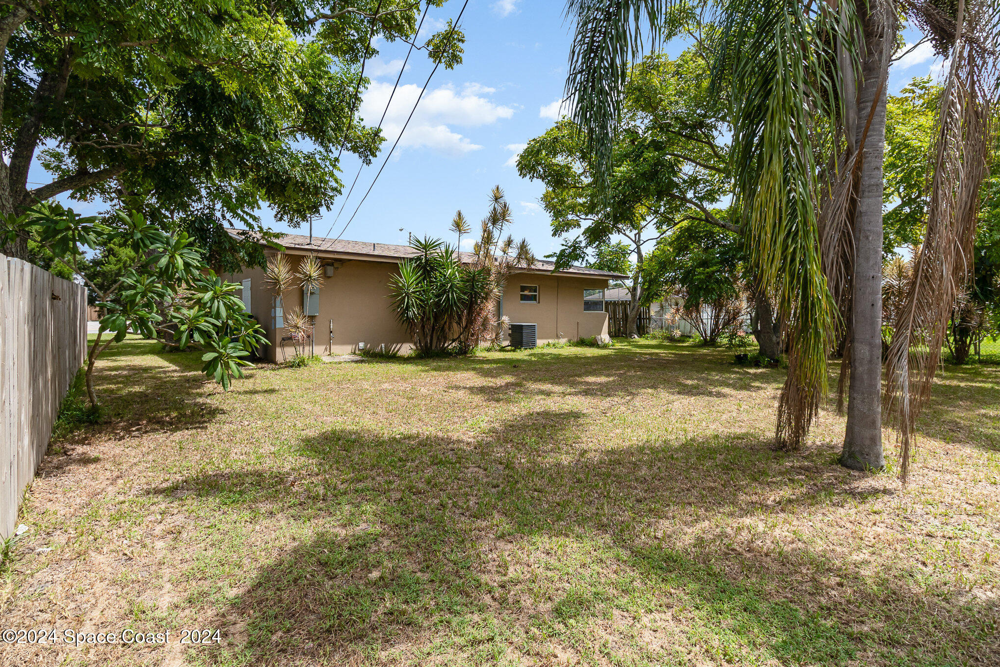 2357 Sarno Road Melbourne, FL 32935 - Photo 16 of 19 a swimming pool with outdoor seating and yard