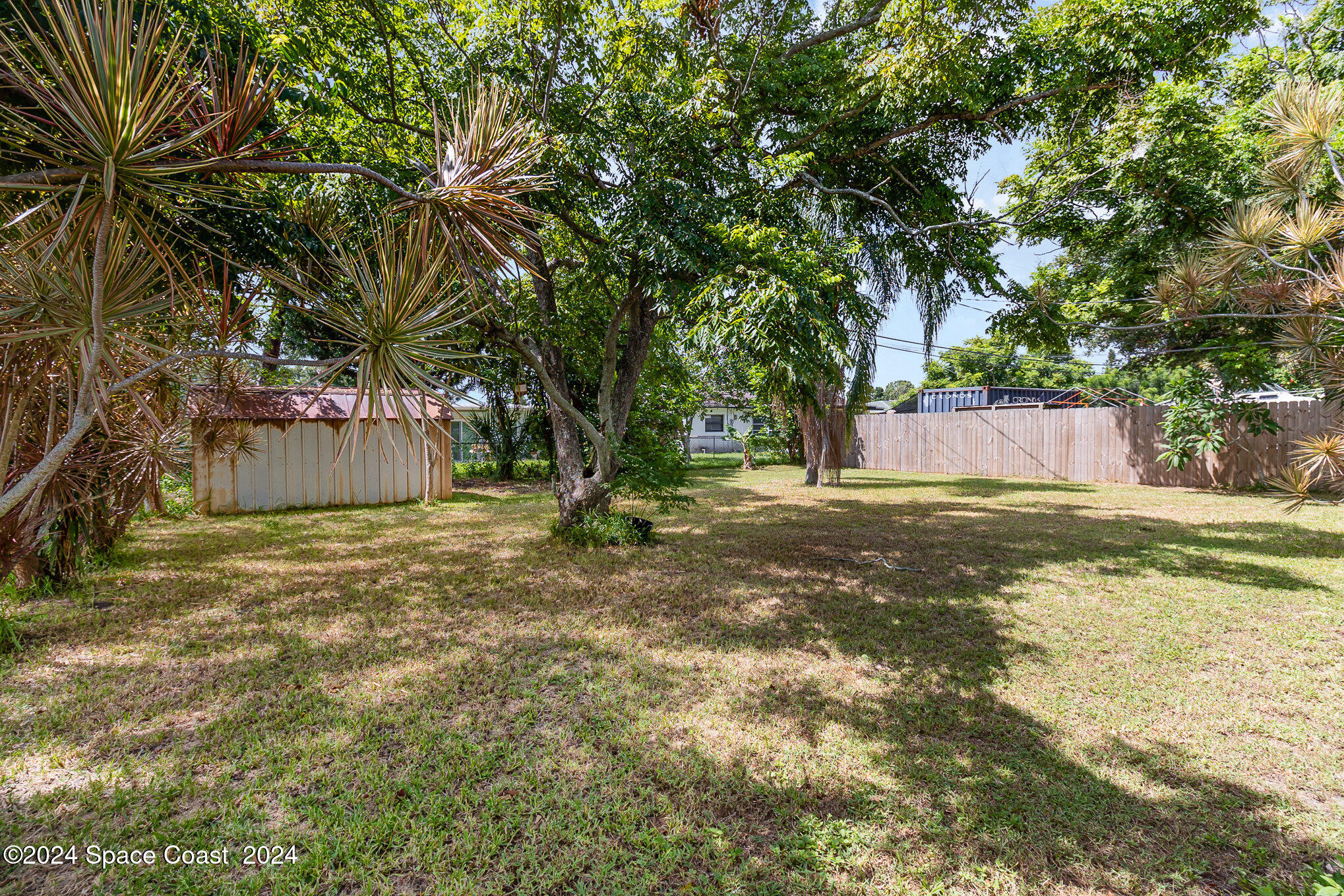 2357 Sarno Road Melbourne, FL 32935 - Photo 17 of 19 a house view with a trees in the background