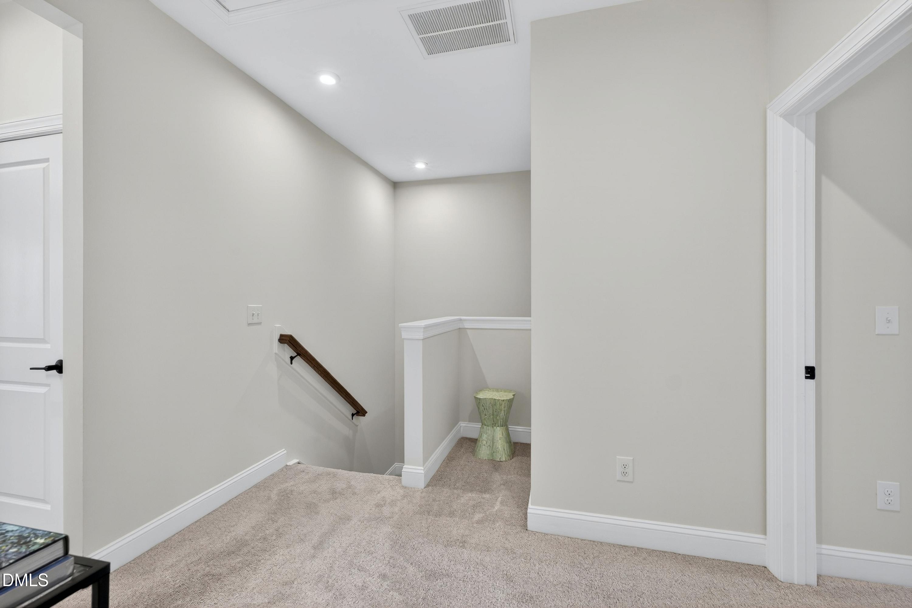 1063 Danvers Loop Apex, NC 27523 - Photo 52 of 67 a view of a hallway with staircase
