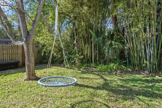 a backyard of a house with lots of green space