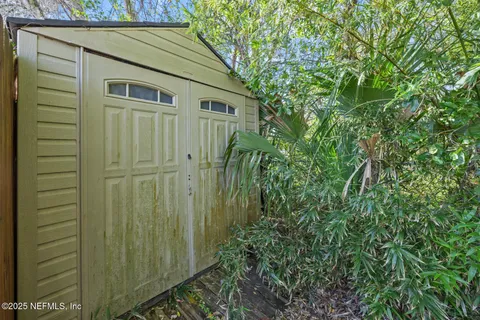 a view of a house with a small yard