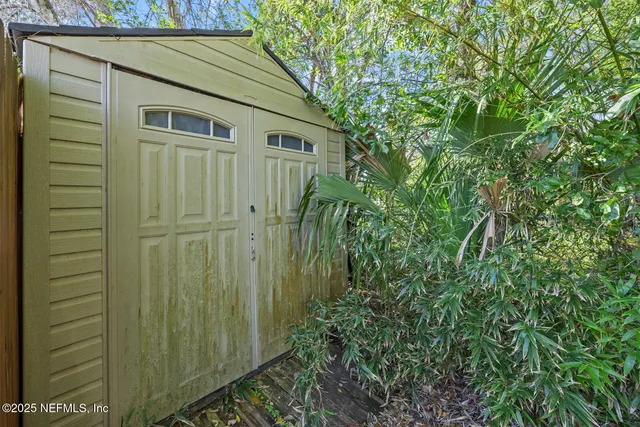 a view of a house with a small yard