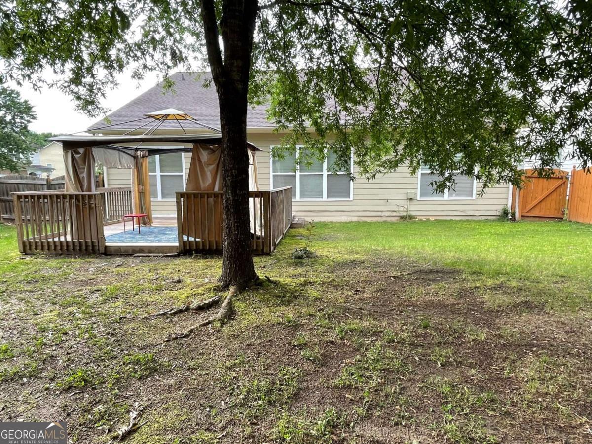 4230 Vinca Way Union City, GA 30291 - Photo 27 of 28 a front view of a house with a yard