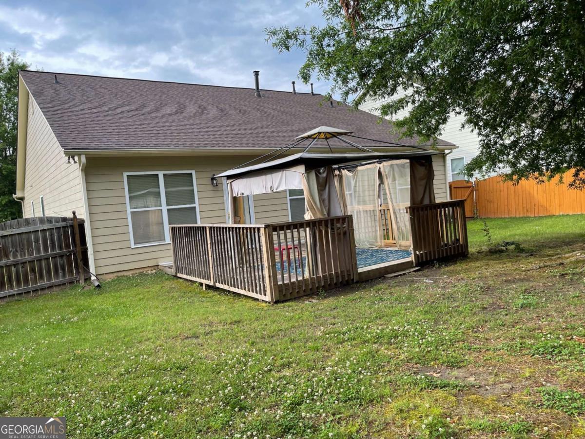 4230 Vinca Way Union City, GA 30291 - Photo 28 of 28 a view of a house with a yard and deck