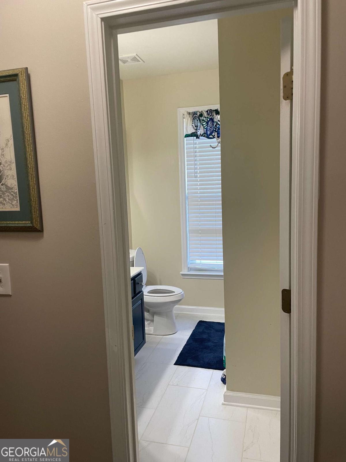 4230 Vinca Way Union City, GA 30291 - Photo 5 of 28 a bathroom with a toilet and a shower