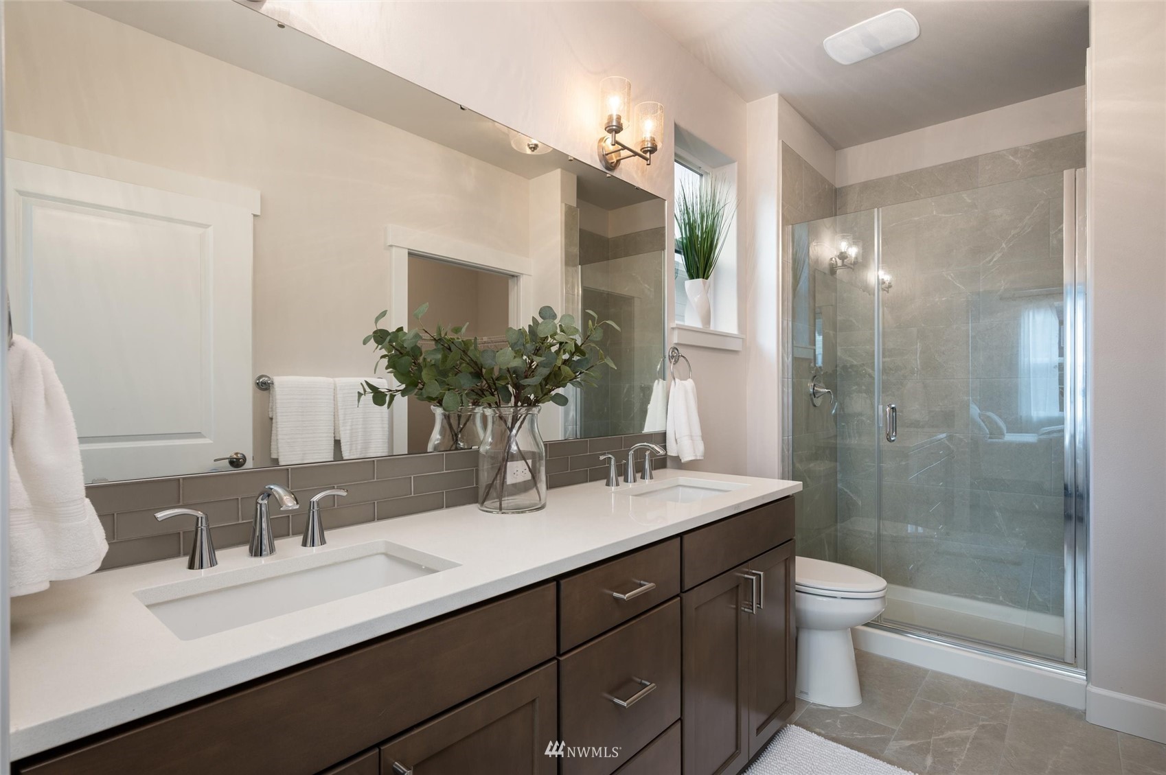 1375 Woods Point Loop Ferndale, WA 98248 - Photo 11 of 19 a bathroom with a sink double vanity granite tub and a mirror