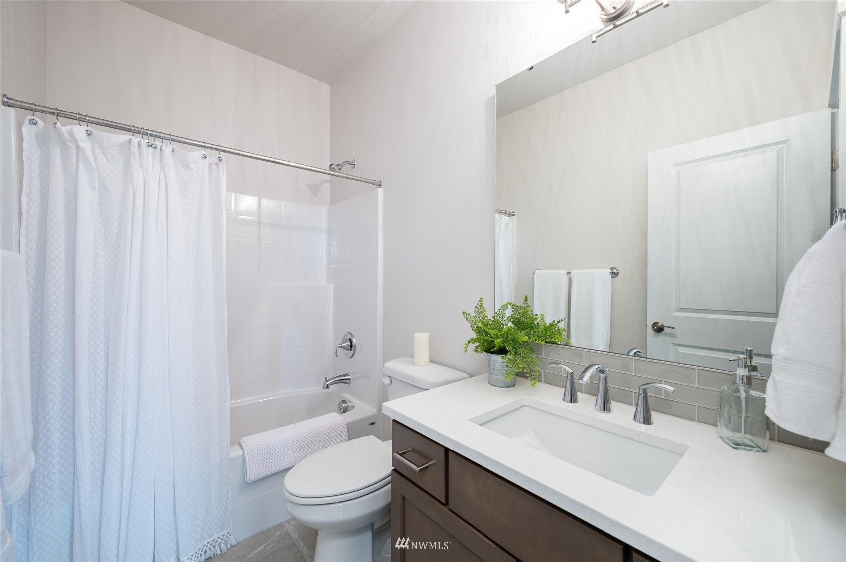 1375 Woods Point Loop Ferndale, WA 98248 - Photo 13 of 19 a bathroom with a granite countertop sink toilet and a mirror