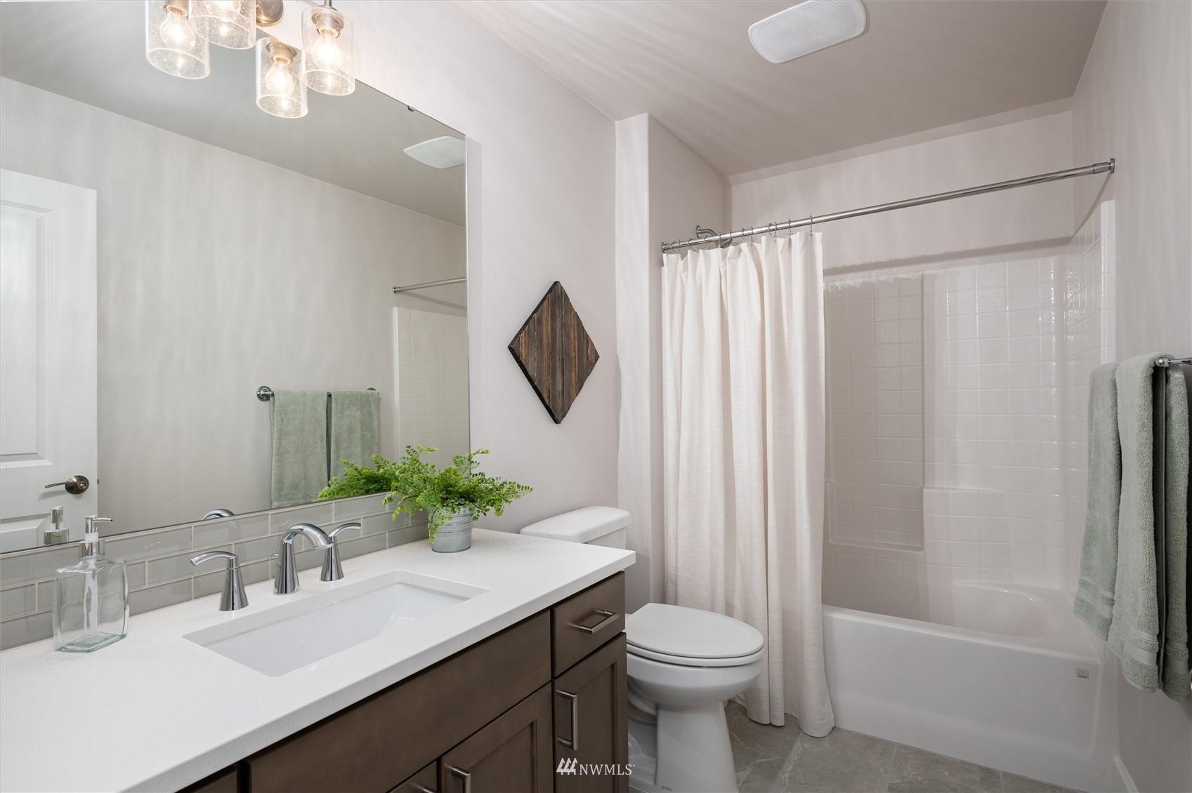 1375 Woods Point Loop Ferndale, WA 98248 - Photo 16 of 19 a bathroom with a sink a toilet and shower