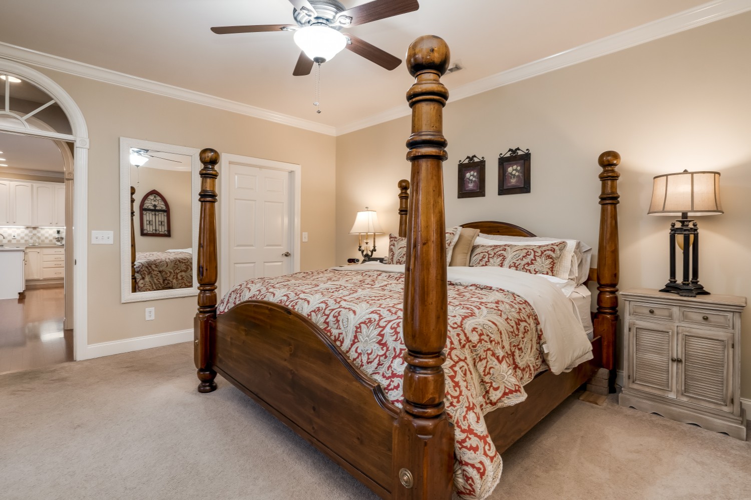 4104 Turnberry Road Spring Hill, TN 37174 - Photo 16 of 34 a bedroom with a bed and a chandelier