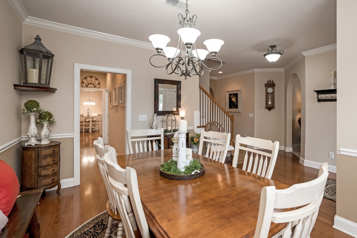 4104 Turnberry Road Spring Hill, TN 37174 - Photo 6 of 34 a view of a dining room with furniture a chandelier and wooden floor