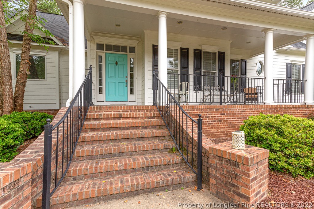 126 Falling Water Road Spring Lake, NC 28390 - Photo 13 of 47 front view of a house with a porch