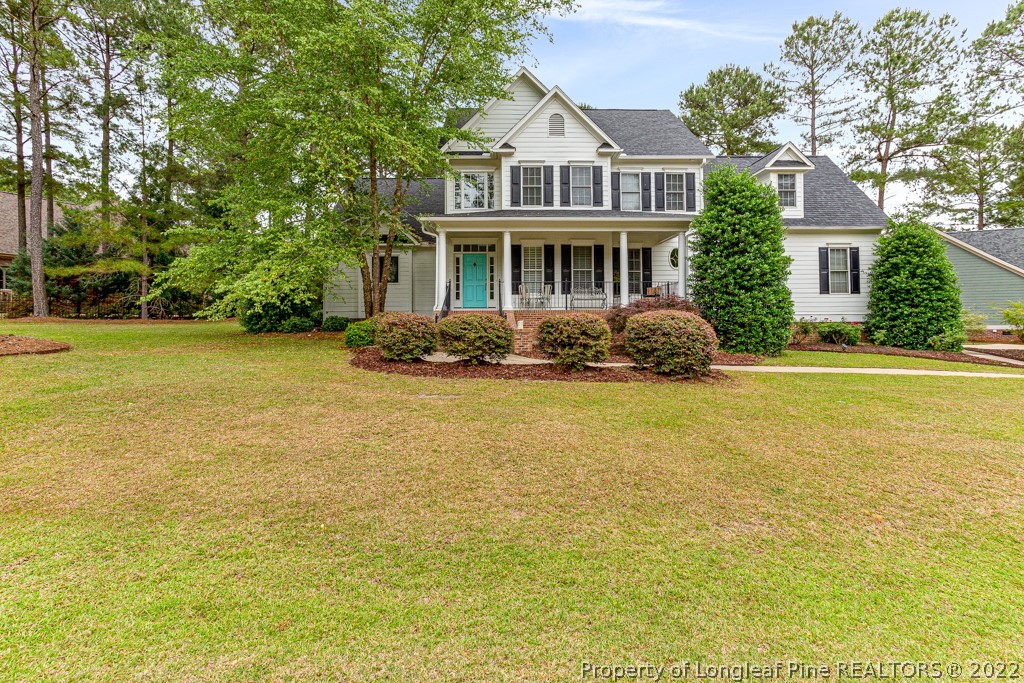 126 Falling Water Road Spring Lake, NC 28390 - Photo 2 of 47 a front view of a house with a yard