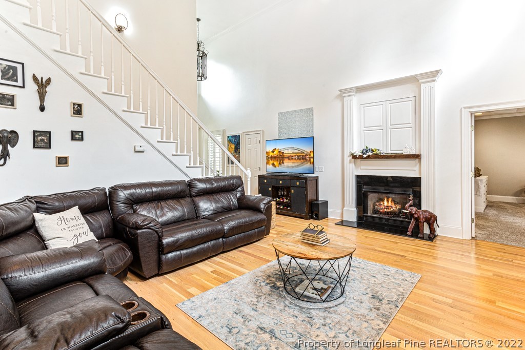 126 Falling Water Road Spring Lake, NC 28390 - Photo 21 of 47 a living room with furniture a fireplace and a table