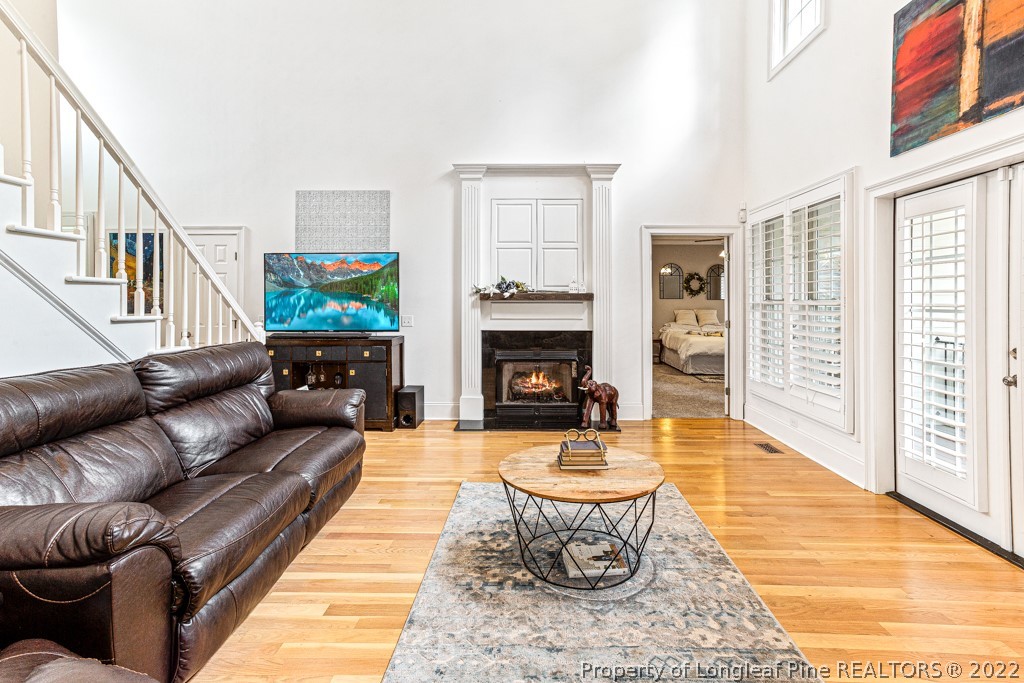 126 Falling Water Road Spring Lake, NC 28390 - Photo 22 of 47 a living room with furniture and a fireplace