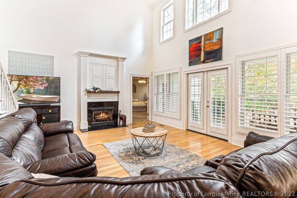 126 Falling Water Road Spring Lake, NC 28390 - Photo 23 of 47 a living room with furniture fireplace and a large window