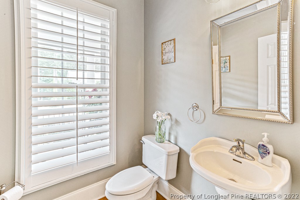 126 Falling Water Road Spring Lake, NC 28390 - Photo 30 of 47 a bathroom with a sink a toilet and tub