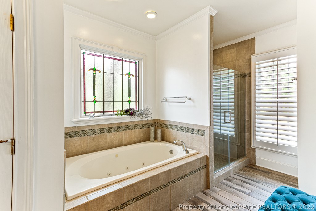 126 Falling Water Road Spring Lake, NC 28390 - Photo 37 of 47 a bathroom with a bathtub and a shower