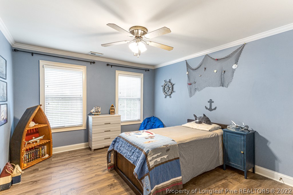 126 Falling Water Road Spring Lake, NC 28390 - Photo 40 of 47 a bedroom with a bed and a window