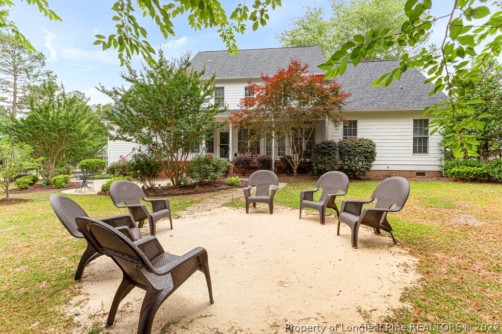 126 Falling Water Road Spring Lake, NC 28390 - Photo 8 of 47 a view of a patio with a table and chairs