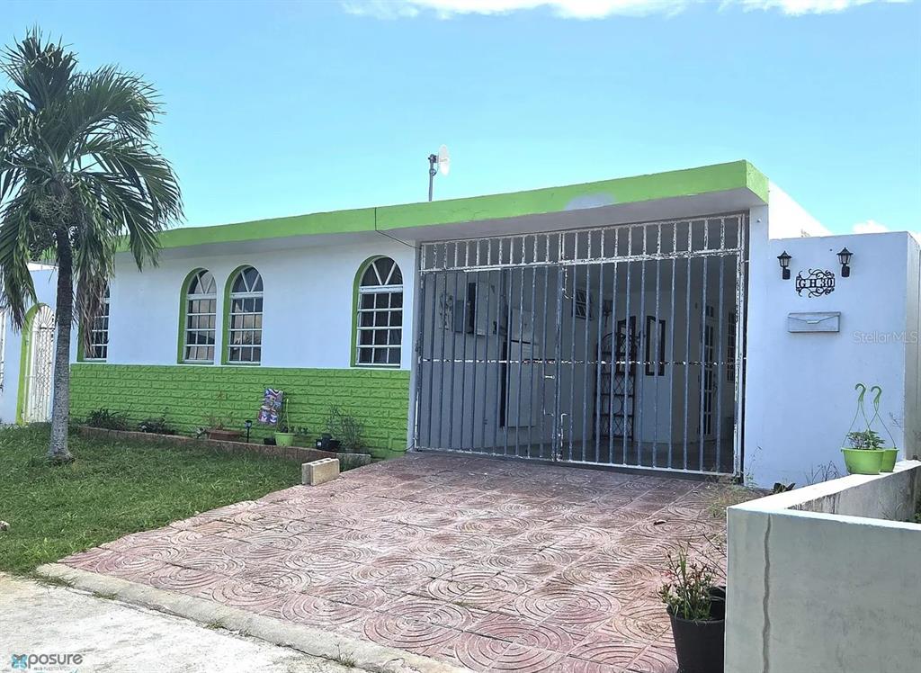 30 Gh Fajardo, Fajardo 00738 - Photo 1 of 1 a view of a house with a yard and potted plants