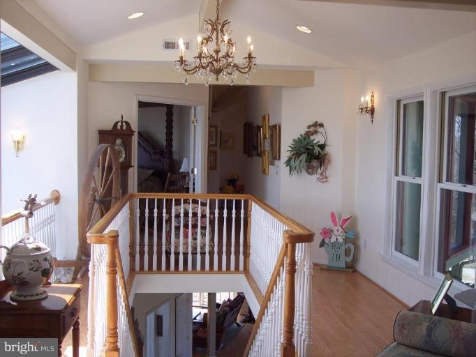 18500 Turkey Ridge Road Northeast Flintstone, MD 21530 - Photo 9 of 25 This hallway overlooks the 2 story solarium.