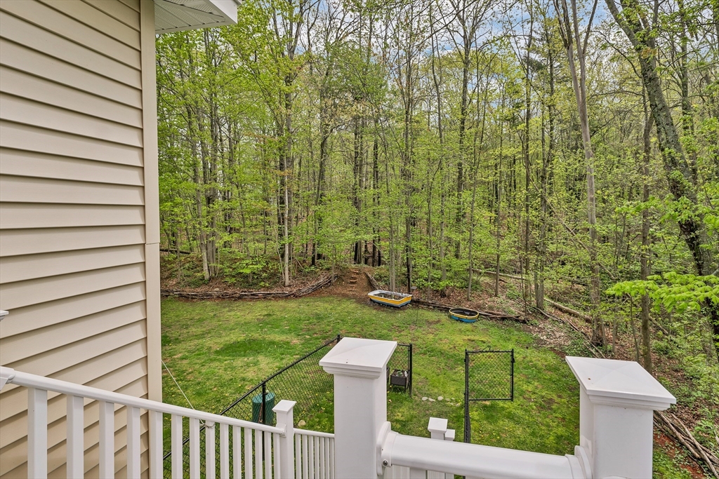 31 Danville Road Hampstead, NH 03826 - Photo 17 of 42 a view of a back yard from a balcony