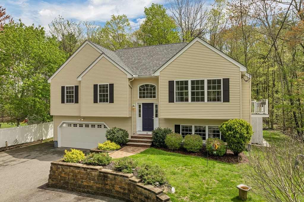 31 Danville Road Hampstead, NH 03826 - Photo 19 of 42 a view of a house with garden