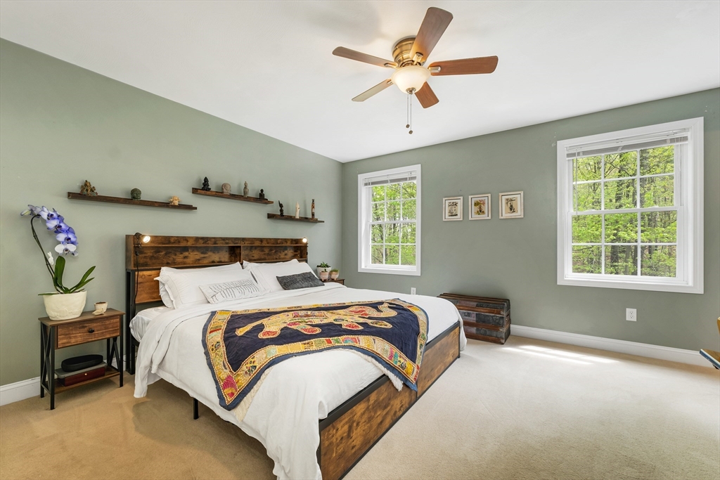 31 Danville Road Hampstead, NH 03826 - Photo 21 of 42 a bedroom with a bed and a window