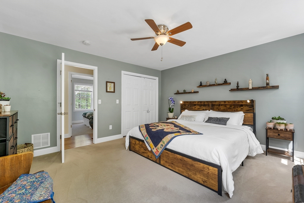 31 Danville Road Hampstead, NH 03826 - Photo 23 of 42 a bedroom with a bed and window