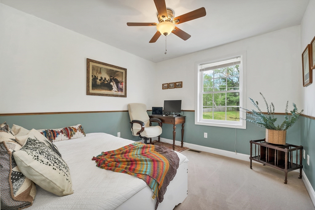 31 Danville Road Hampstead, NH 03826 - Photo 25 of 42 a bedroom with a bed and a window