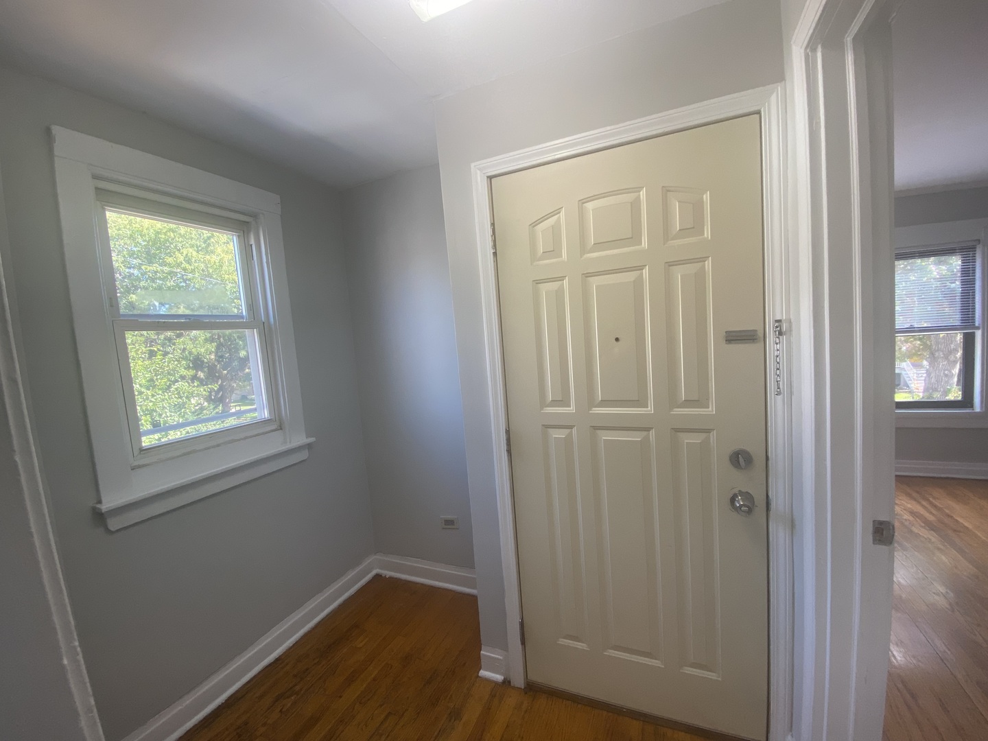 4210 North Kilpatrick Avenue, Unit 2F Chicago, IL 60641 - Photo 5 of 15 an empty room with windows