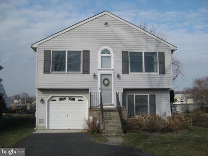 3526 Galloway Road Middle River, MD 21220 - Photo 1 of 12 a front view of a house with a yard and garage