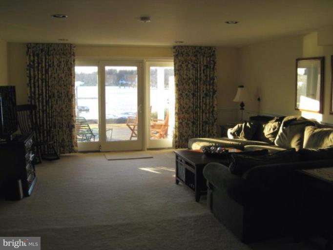 3526 Galloway Road Middle River, MD 21220 - Photo 2 of 12 a bed sitting in a room next to a window