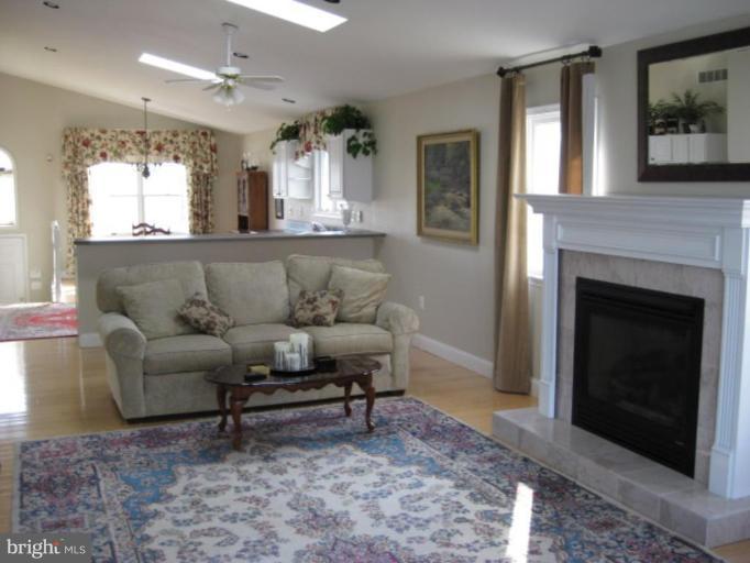 3526 Galloway Road Middle River, MD 21220 - Photo 3 of 12 a living room with furniture and a fireplace