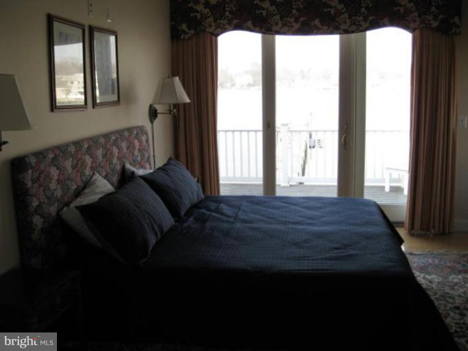 3526 Galloway Road Middle River, MD 21220 - Photo 5 of 12 a bed sitting in a bedroom next to a window