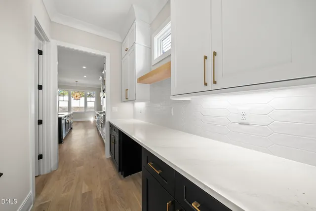 a bathroom with a double vanity sink mirror double shower and a toilet