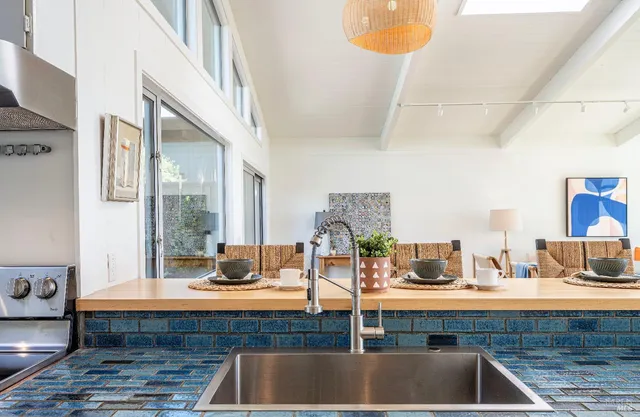 a kitchen with a sink and a counter top space